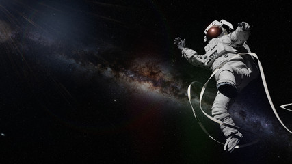 astronaut in front of the stars of the Milky Way galaxy © dottedyeti
