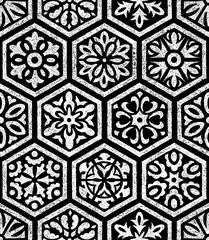 Seamless ornament in patchwork style. Set of hand-drawn hexagons. Black and white print for bohemian style textiles. Grunge texture. Vector illustration.