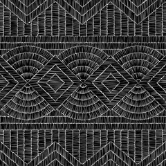 Embroidered geometric ornament. Black patches on a white background. Handmade. Embroidery, fancywork, sewing, hobby. Vector illustration.