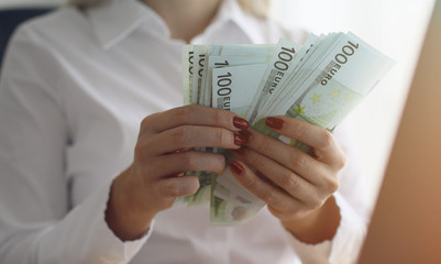 Close up of female hands counting euro banknotes. Business Woman Counting Money.