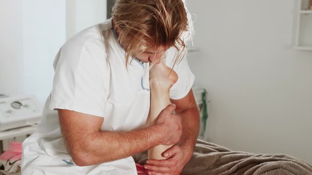 Massage concept. Beautiful young woman reciving relxing massage