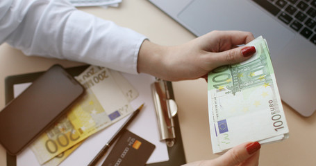 Close up of female hands counting euro banknotes. Business Woman Counting Money.