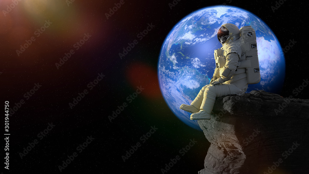 Canvas Prints astronaut sitting on a cliff on the moon in front of planet earth