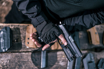 sports shooting instructor check your weapons close-up