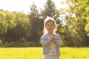 Little girl and summer in the outdoor park