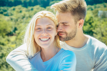 Obraz premium Romantic portrait of a sensual couple in love. Enjoying tender warm pleasant moment of love. Romantic couple caressing in bed.