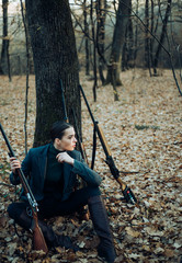 Naklejka premium hunting nature environment. military fashion. achievements of goals. successful hunt. hunting sport. woman with weapon. Target shot. girl with rifle. chase hunting. Gun shop. female hunter in forest