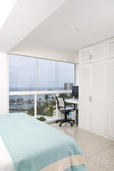 Interior of modern room, overlooking the sea.