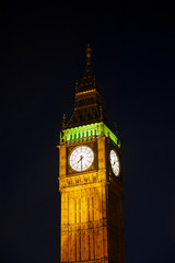 Fototapeta na wymiar Illuminated night view of the gothic Big Ben clock tower standing above Westminster Palace in London, UK