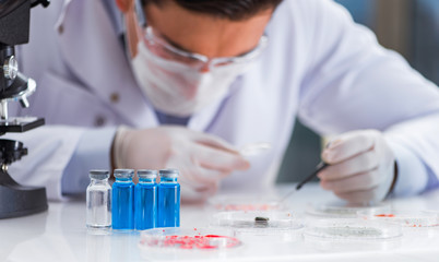 Male doctor working in the lab on virus vaccine