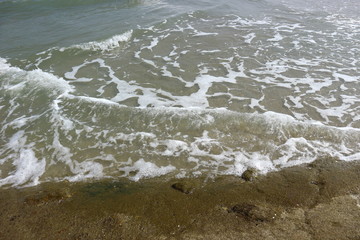 Ocean waves breaking rocks