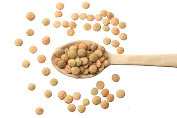 Pile lentil in wooden spoon isolated on white background. Top view.