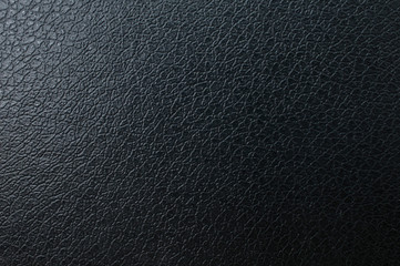 Black fading leather background with a bluish touch