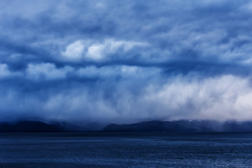 Fototapeta na wymiar Stormy weather at Baikal lake with water and clouds