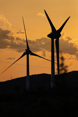 Power generation windmill at sunset