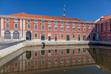 Lisbon, Portugal - October 20, 2019: Caldeirinha Dock water mirror in the newly rebuilt Ribeira das Naus and Arsenal da Marinha Navy building