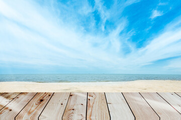 Empty brown wooden table of selected focus and sea water