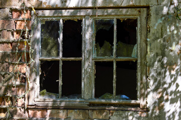 Broken window in abandoned building of abandoned soviet cold war secret east German nuke town