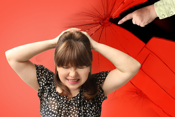 woman covered her head in despair with her hands, a man, husband accusing her finger on her,...