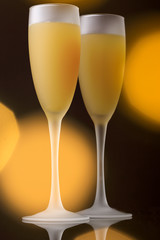 Christmas glasses with apricot liquor, on a dark background