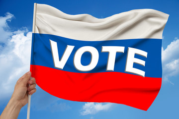 photo of the beautiful colored national flag of the modern state of Russia on textured fabric, concept of tourism, emigration, economics and politics, closeup