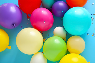 Fototapeta na wymiar Many balloons on color background