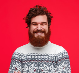 Fototapeta premium Positive bearded guy in sweater