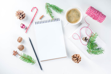 Christmas and New Year background with empty notepad, pen and christmas decorations. To do list, wishlist concept. Mock up, frame, flatlay