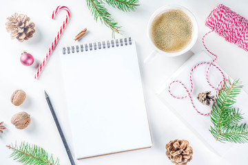 Christmas and New Year background with empty notepad, pen and christmas decorations. To do list, wishlist concept. Mock up, frame, flatlay