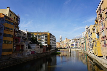 Fototapeta na wymiar Girona, Spain, view from Eiffel Bridge, colourful buildings at the Riu Onyar