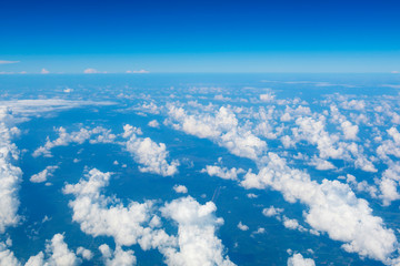 Fototapeta premium landscape look down from the airplane look see the sky and cloud beautiful beautiful in the morning appropriate the background , idea copy space