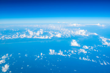 Naklejka na ściany i meble landscape look down from the airplane look see the sky and cloud beautiful beautiful in the morning appropriate the background , idea copy space