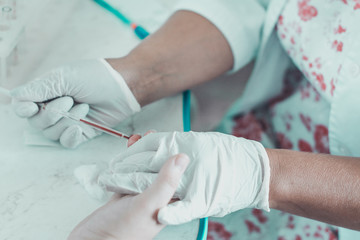 Patient blood sampling by a laboratory technician for general blood testing. 2019