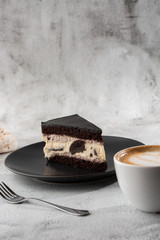 Creamy cheesecake with chocolate cookies and cream biscuits, chocolate cookies and cream biscuits...