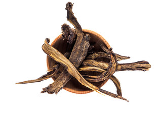 Symphytum root in wooden Cup on white background