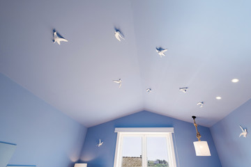 blue ceiling with seagulls in Modern apartment interior design,  small and cozy bed room
