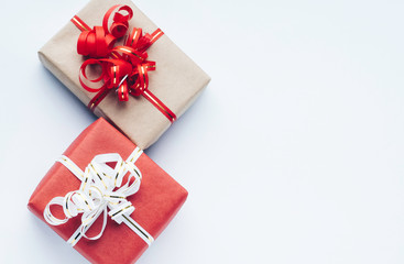 Gift boxes with red and white ribbon on a white background. Christmas, Valentine, birthday concept with a copy space. Top view, flat lay