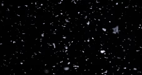 Fototapete Wasserfälle Falling real snowflakes, heavy snow, shot on a black background, frosted, wide-angle, insulated, ideal for digital composition, post-production  © mputsylo