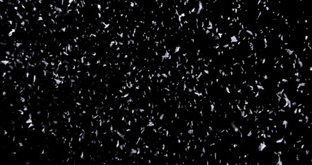 Falling real snowflakes, heavy snow, shot on a black background, frosted, wide-angle, insulated,...