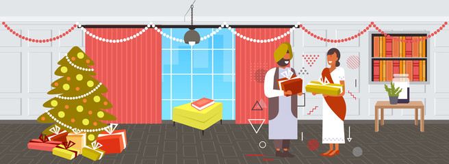 Indian couple giving gift present boxes