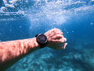 Waterproof sport wrist watches underwater.