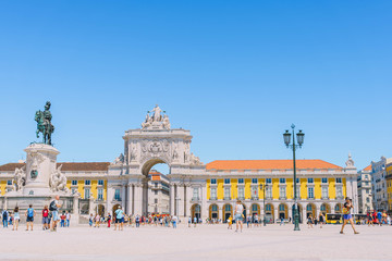 27.08.2019 - Portugal, Lisbon. famous triumphal arch Rua Augusta Arch and statue of King Jose I on on Commerce Square in Lisboa. busy touristic european capital city center. tourists taking photo.
