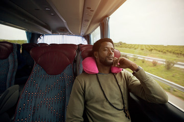 Portrait of man traveling  in touristic bus