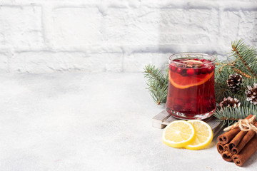 Cranberry juice with lemon and cane sugar. Winter hot drink. Copy space