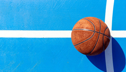 sport concept. old basketball on court. over light