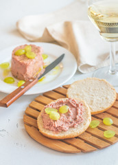Slice of bread with pate on the wooden board