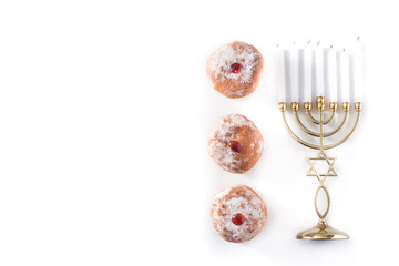 Jewish Hanukkah menorah and sufganiyot donuts isolated on white background. Copy space	