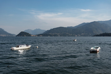 Fototapeta na wymiar Como lake in hot summer day, Lombardy, Italy.
