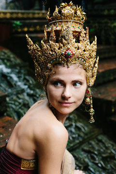 Beautiful White Woman In Thai Traditional Costume. Asian Queen Portrait Outdoor