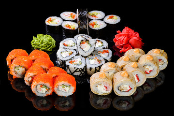 sushi set on a black mirror background